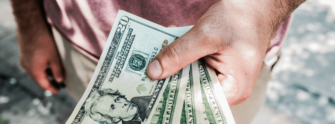 hand holding a cash